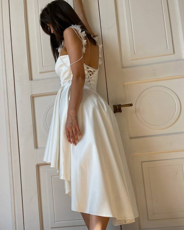 High-low wedding dress with crystal embellishments