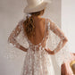 Boho star wedding dress with a romantic A-line shape and elegant boat neckline