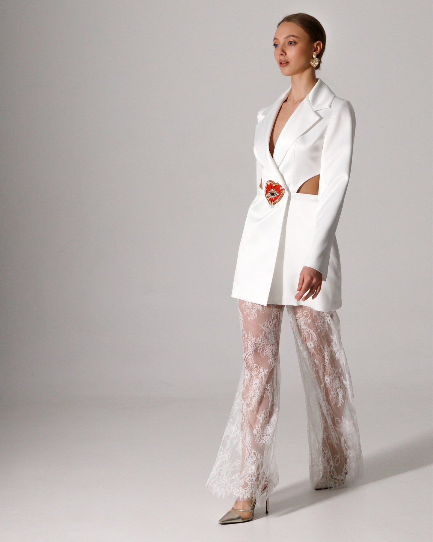 Bridal blazer dress with cutouts and an open-back design for a bold wedding look