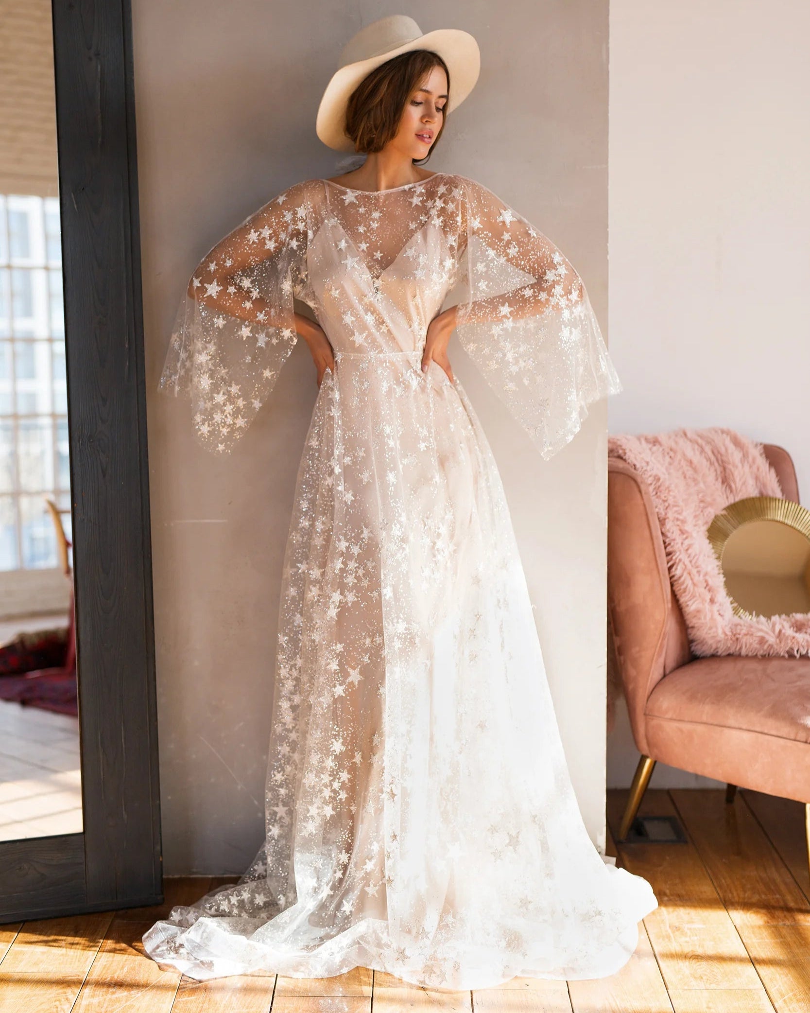 Celestial wedding gown featuring airy sheer fabric with delicate star embellishments