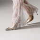 Civil ceremony wedding outfit with a sleek blazer and statement lace pants