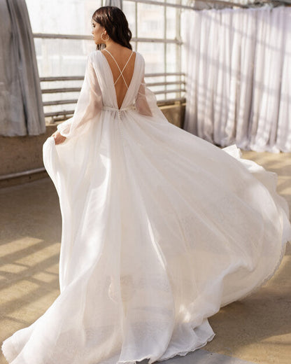 Dreamy boho wedding dress with sheer fabric and a weightless, airy effect