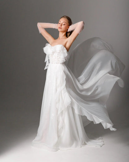 Dreamy embroidered wedding dress with a sheer corset and strapless sweetheart neckline