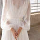 Elegant A-line wedding dress with sleeves and pearl button closures
