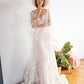 Ethereal boho wedding gown with bell sleeves and sparkling star accents