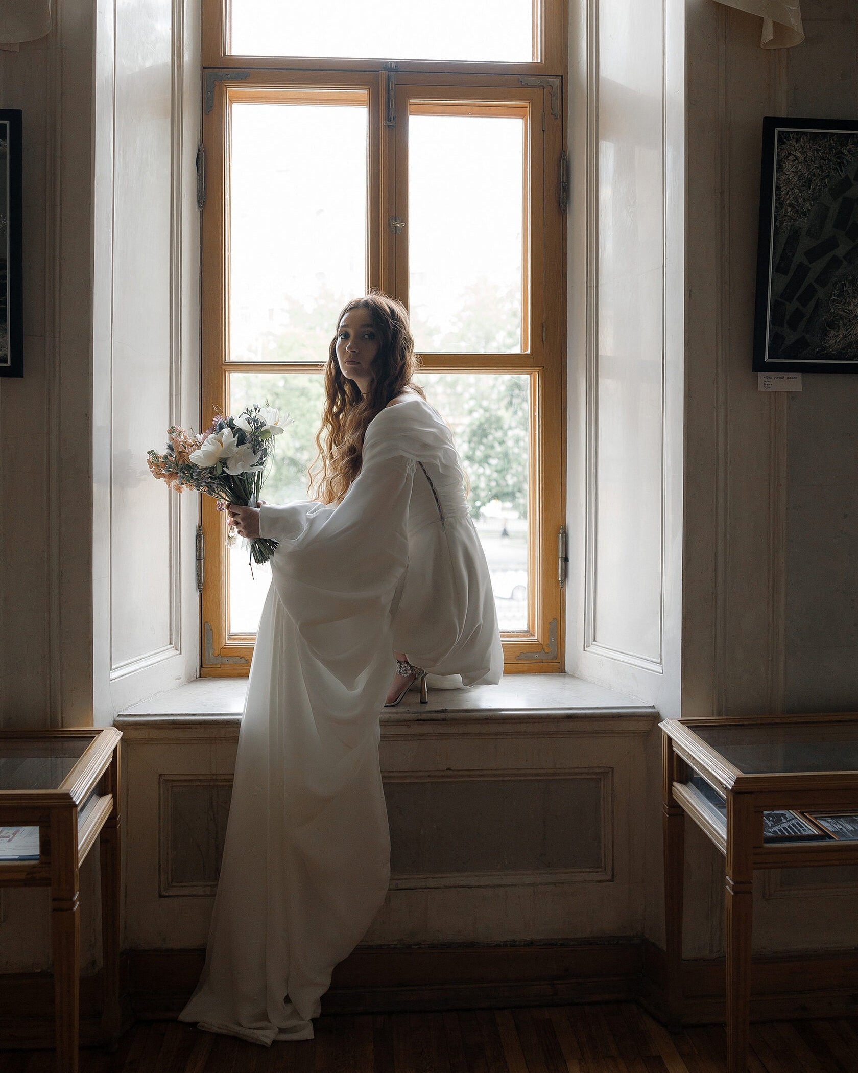 Ethereal dramatic sleeve wedding gown with a playful, modern mini silhouette