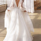 Ethereal organza bridal dress with soft long sleeves and a flowing A-line skirt
