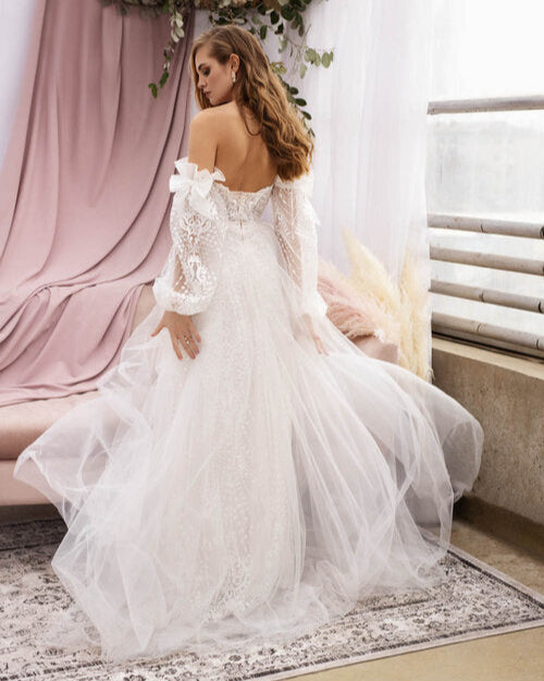 Ethereal tulle and lace wedding dress with delicate pearl and crystal details