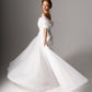 Feminine bridal gown with embellishments featuring hand-sewn pearls and subtle sparkle