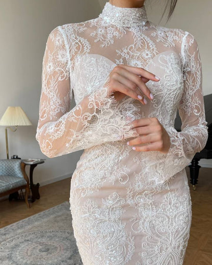 Nude lace overlay wedding dress featuring a sheer illusion neckline for a refined bridal look