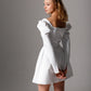 Pearl-embellished bridal dress featuring a luxurious satin fabric and puffed long sleeves
