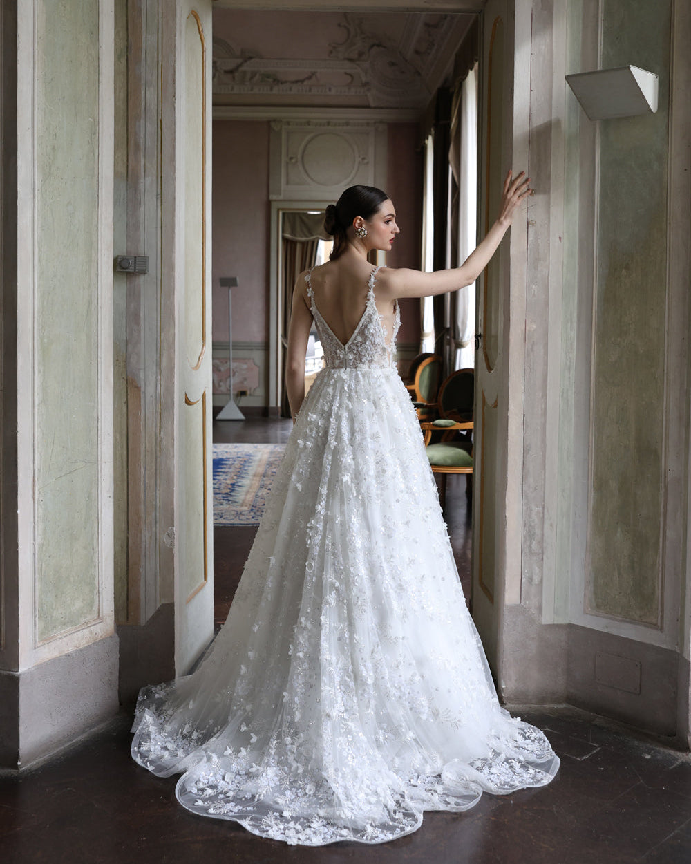 Romantic V-neck bridal gown with delicate floral lace and an airy silhouette