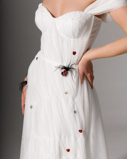 Sculpted corset bridal gown with off-the-shoulder straps and a flowing A-line silhouette