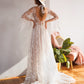 Sheer starry bridal dress with lightweight fabric and whimsical celestial embroidery