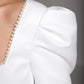 Square neck wedding dress with a stylish, high-waisted design and flowing satin skirt