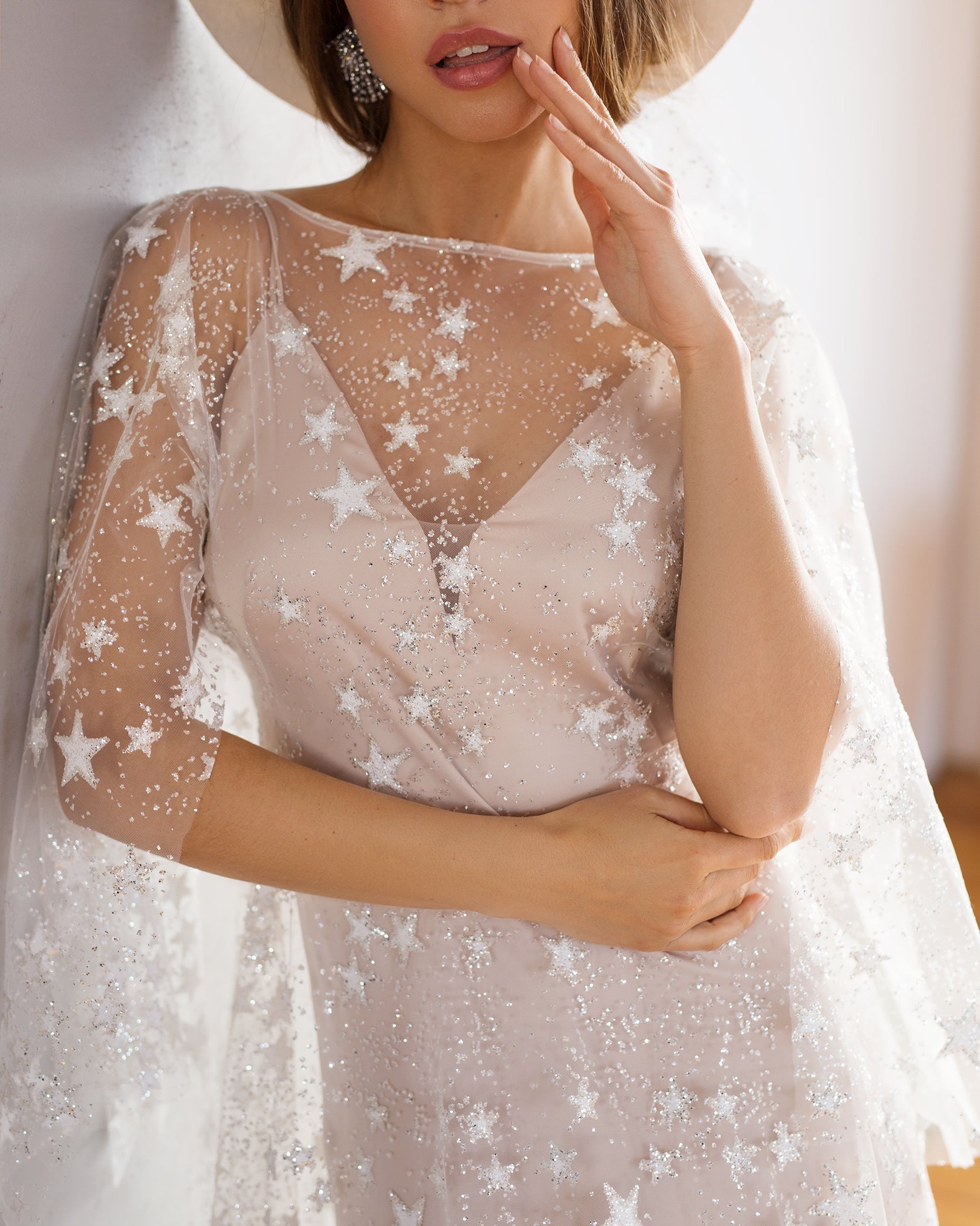 Starry boho wedding dress with shimmering celestial embroidery and a flowing silhouette