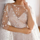 Starry boho wedding dress with shimmering celestial embroidery and a flowing silhouette