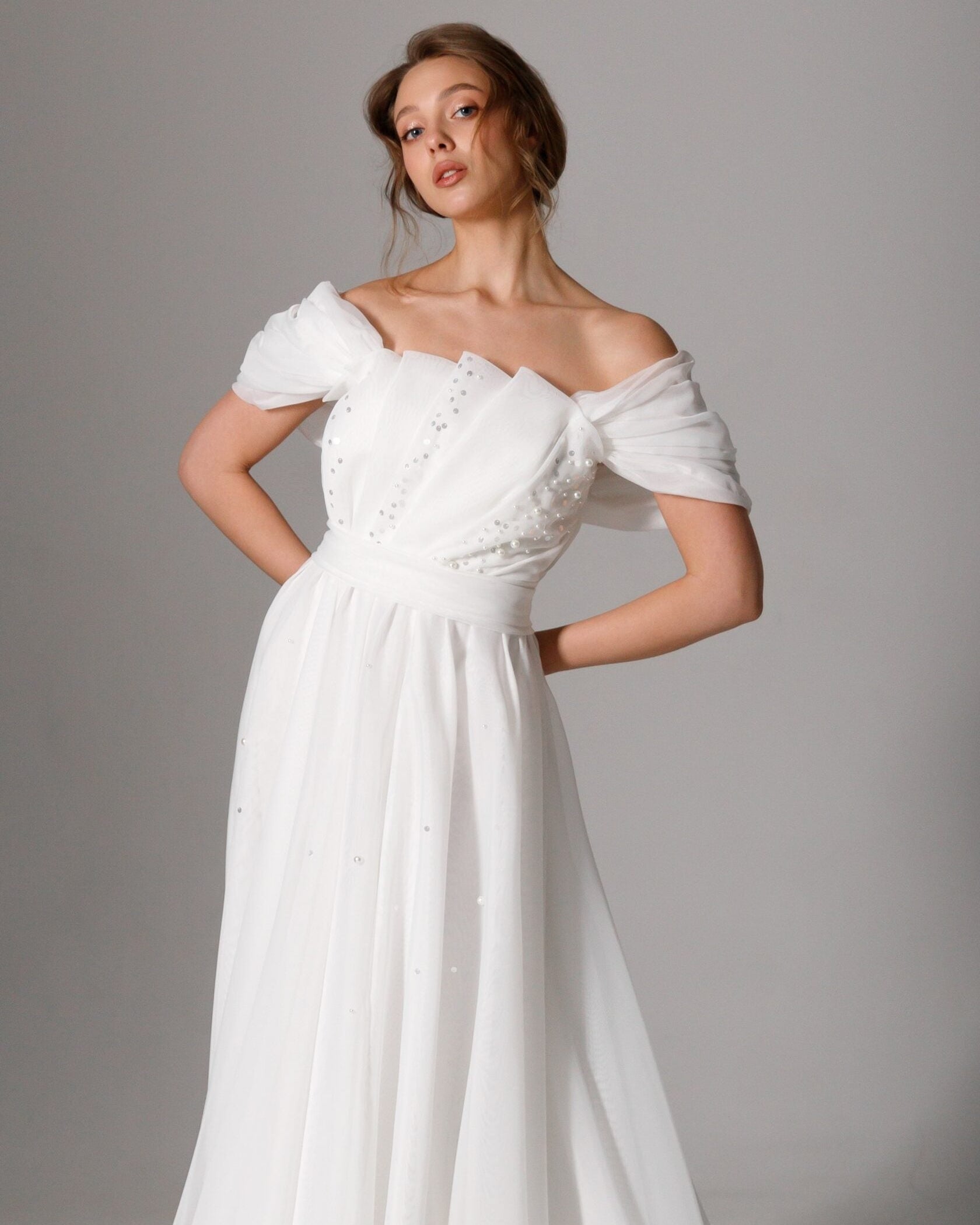 Whimsical organza bridal dress with romantic off-shoulder puff sleeves